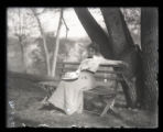 Mrs. Roberts sitting on a bench