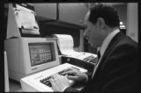 A person using a computer in the School of Business and Economics at UMD