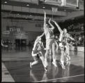Action shot of UMD 1999 women's basketball player #41 making a basket