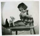 Child with a toy fawn