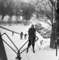Skiers using a rope tow to reach the top of Rock Hill