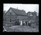 Mr. Cummings's log home with group standing in front of it