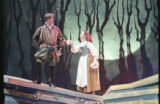 Two actors performing on stage in the 1999 UMD production of "Into the Woods"