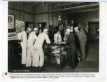 Central Desk - YMCA Hut, League Island Navy Yard, Philadelphia. Many services given at this counter - literature distributed, money orders sold, safekeeping of money, stamps, and cards, soap and towels, sweets and tobacco, mail and general information...