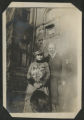 Dale Hartley and Rives Mortimer Baker standing in front of the Hartley house at 1305 East Superior Street