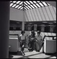 Three women's studies students walking up staircase in the UMD Library Annex