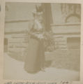 Rachel Woodward standing in the walkway in front of the Hartley house at 1305 East Superior Street