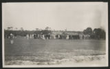 Crowd of people gathered on a golf course