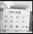 Ven Den sign decorated with hearts and flowers