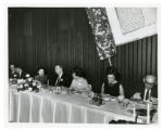 Seven people sitting at the head table at the 1967 Jewish Community Center annual meeting, St. Paul, Minnesota