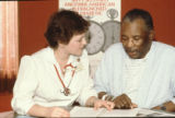 Nurse Melanie Revine educates a patient about diabetes, Mount Sinai Hospital, Minneapolis, Minnesota