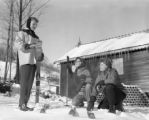 People gathered in front of a building on Rock Hill in winter