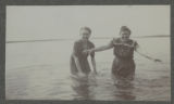 Carrie Eliza Hartley wading in Cass Lake with one other person