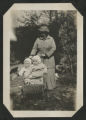 Carrie Eliza Hartley pushing two babies in a stroller at the maple sugar camp in Trout Lake