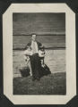 Cavour Hartley holding John and David Hartley outside of the Hartley house at 1305 East Superior Street