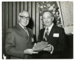 E. David Krawetz presents Sylvan J. Mack a plaque naming him a life member of the Jewish Community Center board of directors, St. Paul, Minnesota