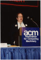 Man Giving Presentation at ACM Annual Meeting (Box 4, Folder 7)