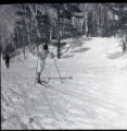 Action shot of UMD 1965 downhill skier during a tournament