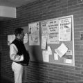 Student looking at a bulletin board in Kirby Student Center