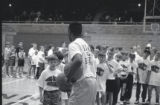 UMD 1993 men's basketball player teaching kids during basketball camp