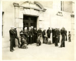 Sailors and shoeshine boys in front of the William Sloane House YMCA in New York City
