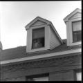 Person sticking their head out of a window from Torrance Hall