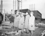 Four people at the Kirby Student Center construction site