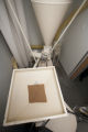 Milling wheat at a small bakery in Maplewood,Minnesota, where breads, muffins, rolls and cookies are baked using Whole grains.