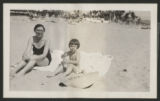 Judith Hartley and Caroline Hartley Lewis sitting on a towel on Miami Beach