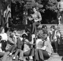 Man talking to group of students sitting on stairs at Freshman Camp