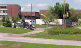 Robert W. Bridges Fleet Grounds Maintenance Building with work trailers and cranes