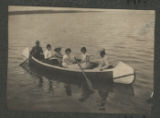 Members of the Hartley family rowing a canoe on Cass Lake